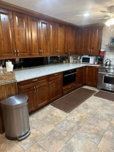 A sparkling clean kitchen with tidy countertops and a spotless floor after house cleaning by Teri Lynn's Cleaning in Williston, ND.