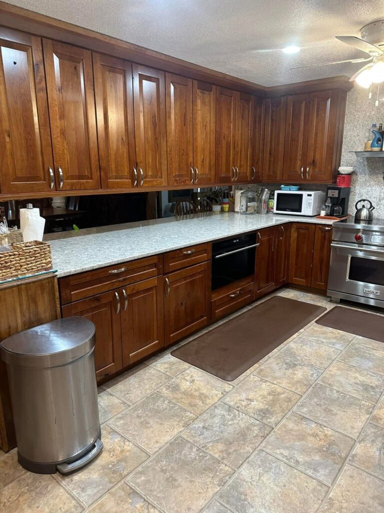 A sparkling clean kitchen with tidy countertops and a spotless floor after house cleaning by Teri Lynn's Cleaning in Williston, ND.