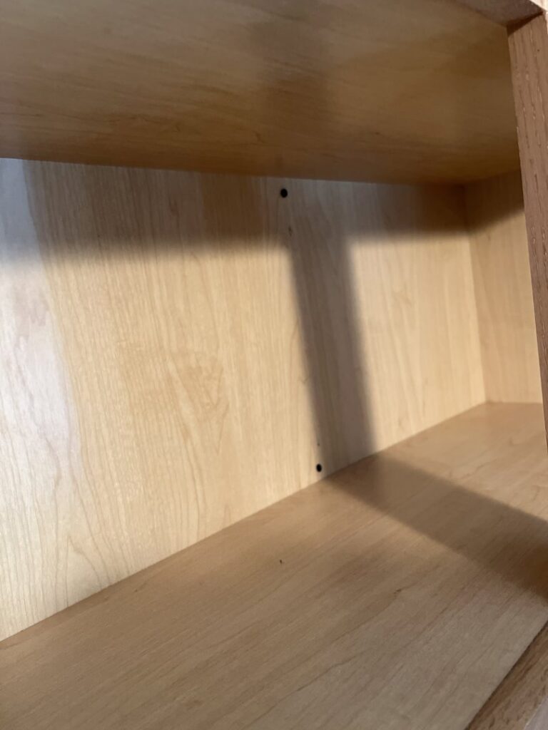 A spotless kitchen cabinet interior, cleaned by Whole New World Cleaning Service, LLC in Wilmington, DE