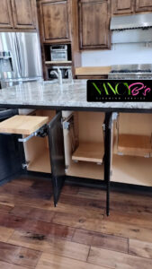 Clean kitchen cabinets with open doors showing spotless interiors by Nancy B's Cleaning Service LLC in Atlanta, GA.