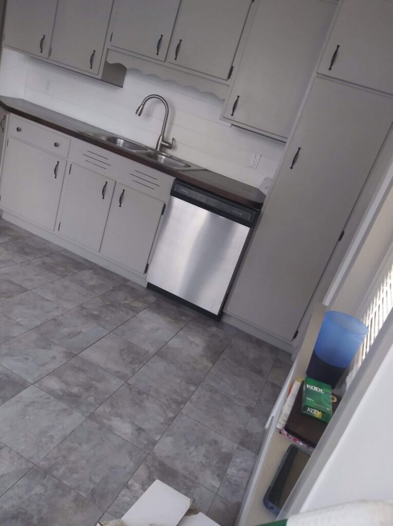 A clean kitchen showing cabinets, sink, and dishwasher after professional cleaning by Rebeccas Customized Cleaning LLC in Reading, PA.