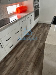 A sparkling clean kitchen counter and floor after a professional cleaning by SuiteSpot Cleaners in Las Vegas, NV.