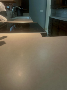 A pristine kitchen countertop and clean electric stovetop, reflecting the quality service of BLACK PEARL Cleaning CO. in Greenwood, MO.