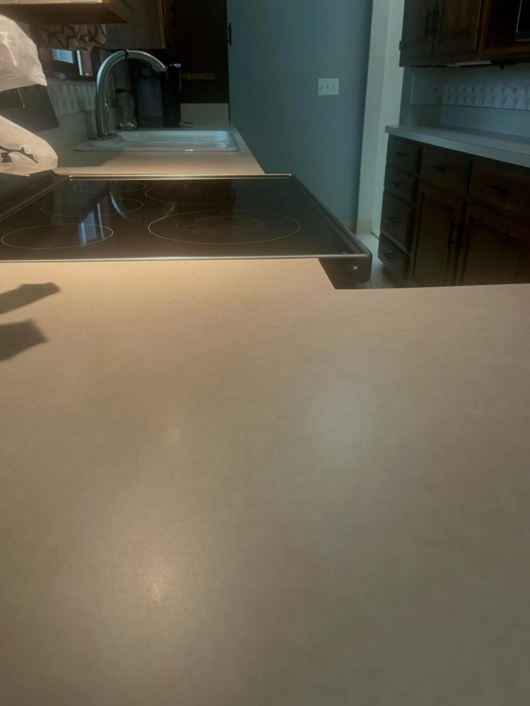 A pristine kitchen countertop and clean electric stovetop, reflecting the quality service of BLACK PEARL Cleaning CO. in Greenwood, MO.