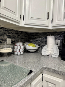 A sparkling clean kitchen countertop with organized items, showcasing the work of BNB Cleaning Pros in Hastings, NE.
