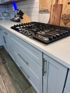 A clean kitchen countertop and modern stovetop, demonstrating the meticulous cleaning by JBO Cleaning Services in Belle Chasse, LA.