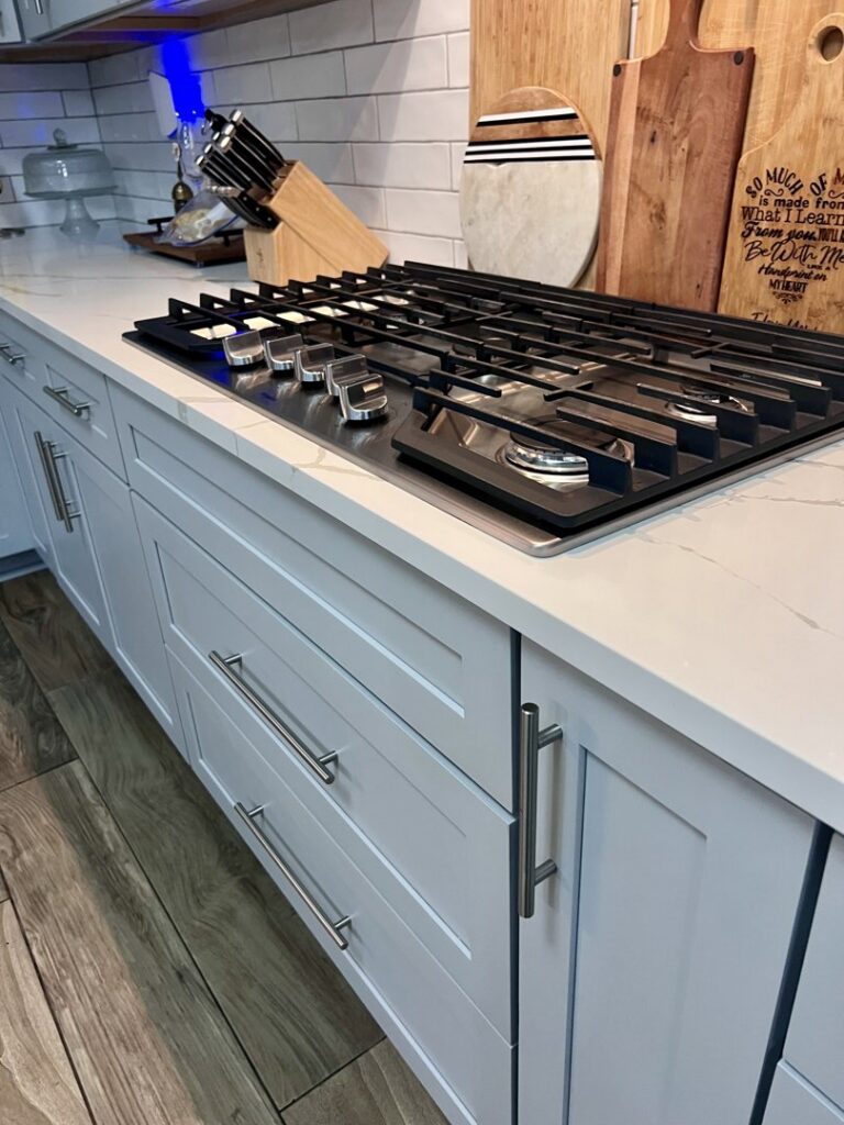 A clean kitchen countertop and modern stovetop, demonstrating the meticulous cleaning by JBO Cleaning Services in Belle Chasse, LA.