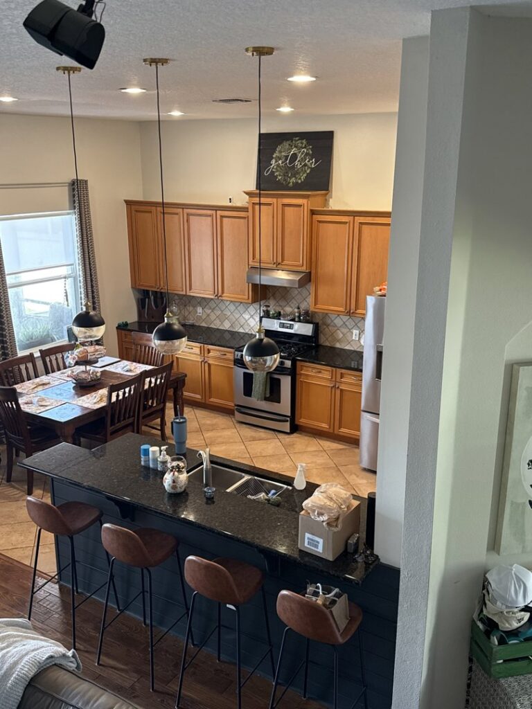 An overhead view of a clean and tidy kitchen and dining area, showcasing the results of Nichole's Cleaning Service in Fort Wayne, IN