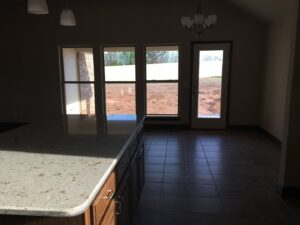A bright and clean kitchen and dining area with tiled floors, professionally cleaned by Pristine Cleaning Concepts in Stillwater, OK.