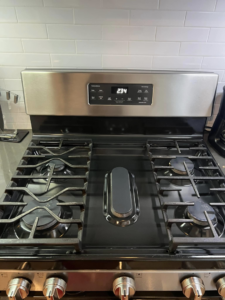A spotless clean kitchen gas stove, demonstrating the thorough work of F & E House Cleaning Services in Los Angeles, CA.