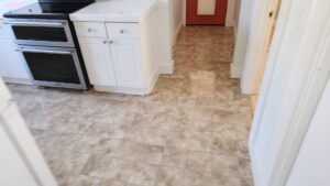 A freshly cleaned kitchen floor extending into a hallway, demonstrating the floor cleaning expertise of Eyedeal Cleaning Services in Gresham, OR.