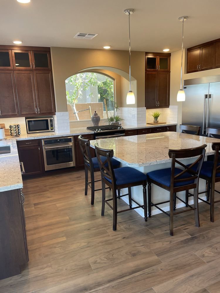 A beautifully cleaned kitchen featuring a large island and dark cabinets by SuiteSpot Cleaners in Las Vegas, NV.