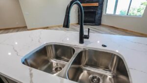 A clean kitchen island sink and faucet, demonstrating the meticulous cleaning services of Home Clean Home By Maria LLC in Aberdeen, SD.
