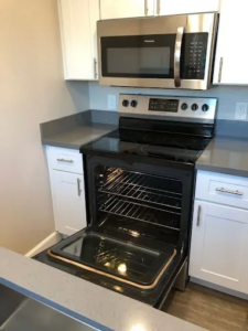 A sparkling clean kitchen oven after a professional cleaning service by Maid 2 Clean San Diego, CA