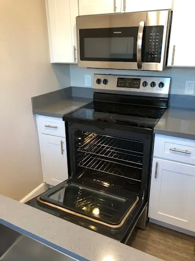 A sparkling clean kitchen oven after a professional cleaning service by Maid 2 Clean San Diego, CA