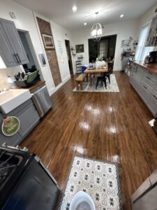 A beautifully cleaned kitchen with gleaming wooden floors, showcasing the results of Wilkie Wonders Cleaning in Akron, OH.