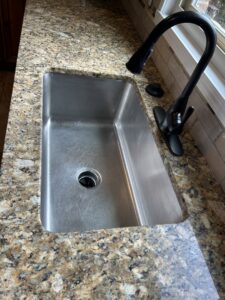 A sparkling clean kitchen sink after professional cleaning by Perfections Quality Cleaning Service in Dayton, OH.