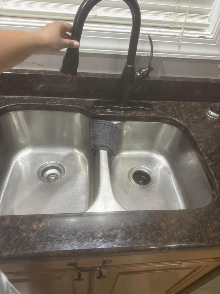 A sparkling clean kitchen sink, ready for use, by Chelle's Cleaning Services in Gary, IN.