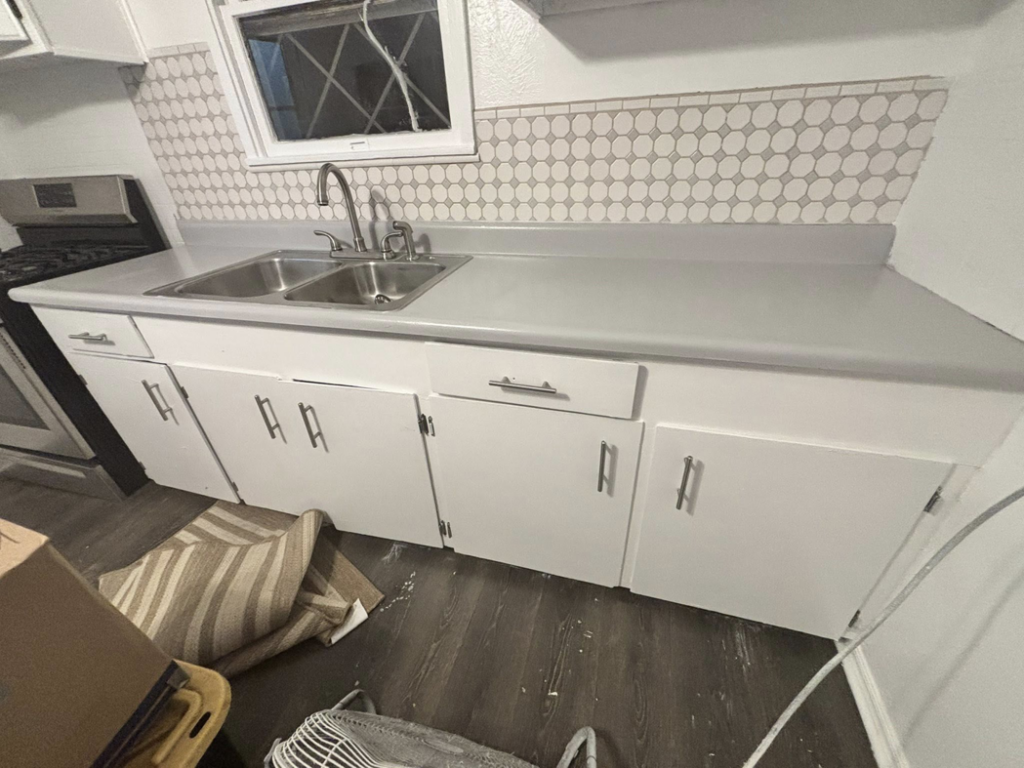 A sparkling clean kitchen sink and countertops after a professional cleaning by Apryl's Cleaning Service in Corpus Christi, TX.