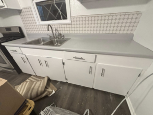A sparkling clean kitchen sink and countertops after a professional cleaning by Apryl's Cleaning Service in Corpus Christi, TX.