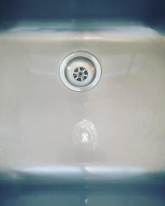 A sparkling clean kitchen sink drain, showcasing the detailed cleaning service by Wholesome-Green Cleaning in Saint Croix Falls, WI.