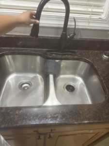 A clean kitchen sink and faucet, meticulously cleaned by Chelle's Cleaning Services in Gary, IN.