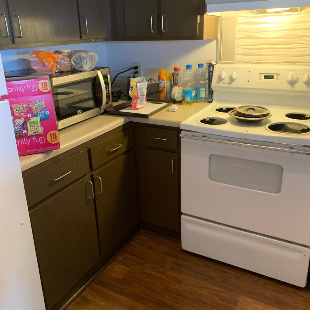 A clean kitchen stove and microwave area, showcasing the results of Premier Uptown Clean services in Charlotte, NC