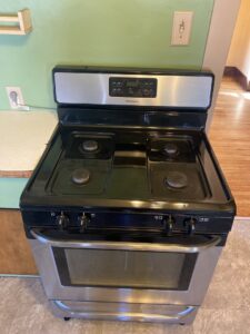 A sparkling clean kitchen stove and oven, demonstrating the detailed appliance cleaning by Final Touch & More in Fort Wayne, IN