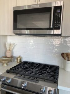 A sparkling clean kitchen stovetop and microwave, professionally cleaned by Maid 2 Clean San Diego, CA