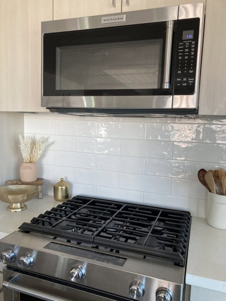 A sparkling clean kitchen stovetop and microwave, professionally cleaned by Maid 2 Clean San Diego, CA
