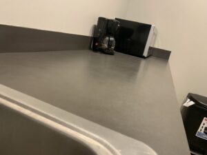 A clean kitchenette counter and sink area, maintained by West & Co Cleaning Services in Laurel, MD