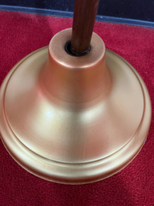 A polished brass lamp base after professional cleaning by Ascent Cleaning Solutions, LLC in Nashville, TN