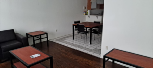 A clean and organized living and dining area with mixed flooring, reflecting the quality house cleaning by Solid Rock Cleaning Company LLC in Orlando, FL