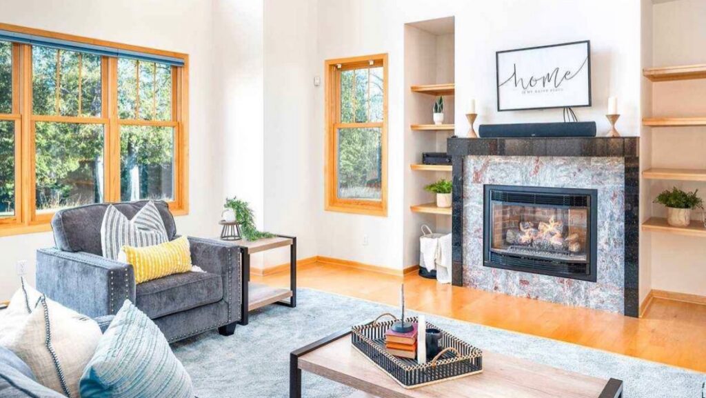 A clean and cozy living room with a fireplace and hardwood floors, reflecting Tidy Details' house cleaning in Duluth, MN.