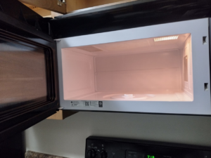 A clean and sparkling microwave interior after professional cleaning by By Grace Cleaning Solutions, LLC in Cincinnati, OH.