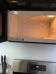 A perfectly clean microwave interior, highlighting the detailed cleaning by F & E House Cleaning Services in Los Angeles, CA.