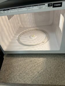 The clean interior of a microwave oven, thoroughly cleaned by Green Leaf Janitorial in Gilbert, AZ.