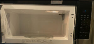 The clean interior of a microwave oven, demonstrating the detailed appliance cleaning services of Merriweather Cleaning and Laundry in Vancouver, WA.