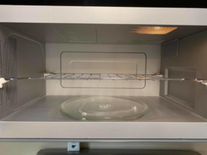 The sparkling clean interior of a microwave oven after professional cleaning by Quality Cleaning in Summerville, SC.