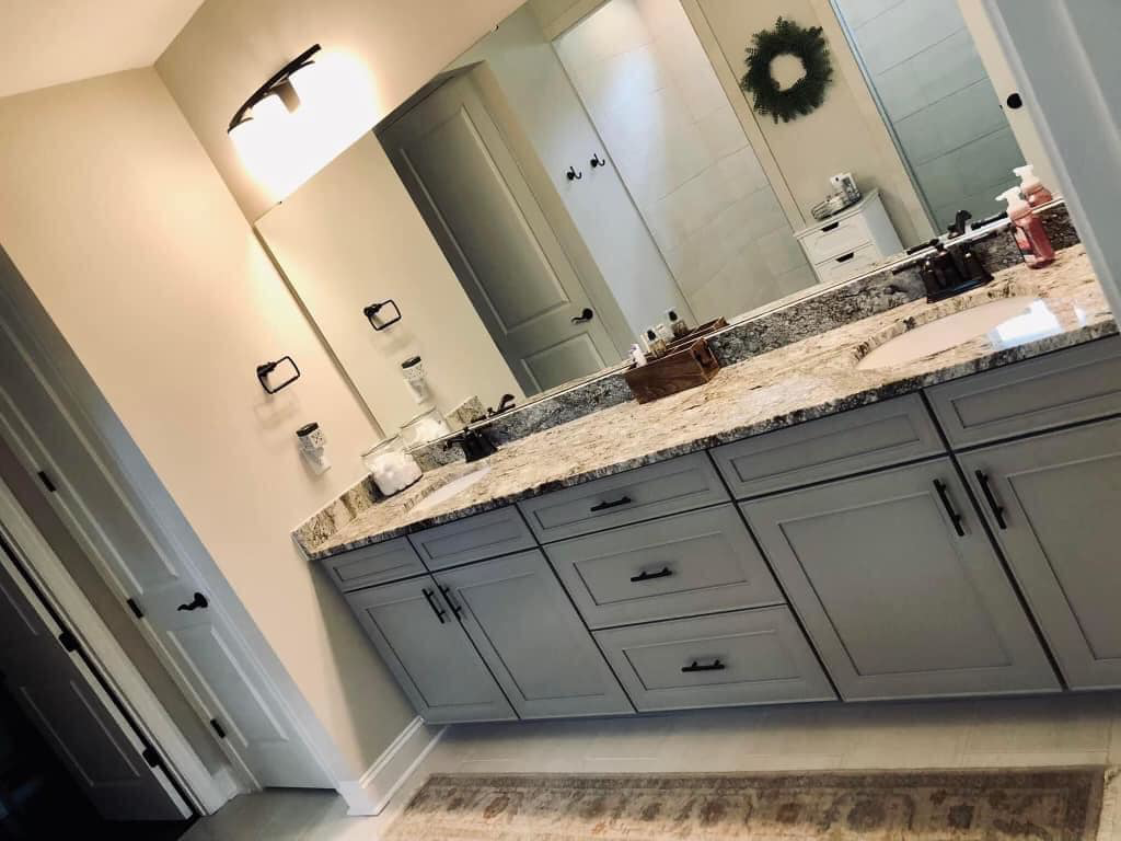 A sparkling clean, modern bathroom with a double vanity, expertly cleaned by Carolina Clean SC, LLC in Rock Hill, SC.