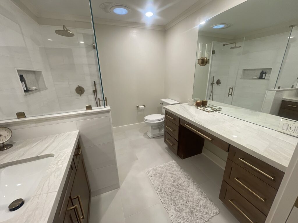 A clean, modern bathroom with a spotless shower and vanity, cleaned by Maid 2 Clean San Diego, CA
