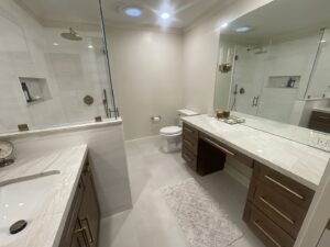 A clean, modern bathroom with a spotless shower and vanity, cleaned by Maid 2 Clean San Diego, CA