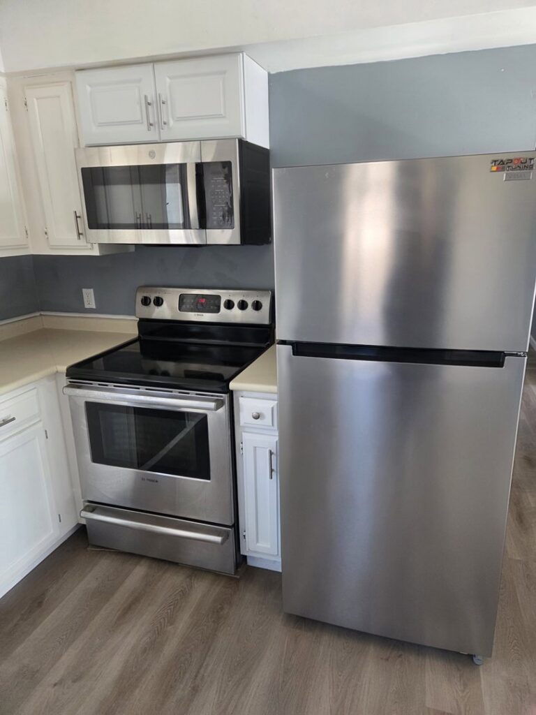 A clean and modern kitchen with stainless steel appliances after professional cleaning by Hm General Cleaning Services in Schenectady, NY