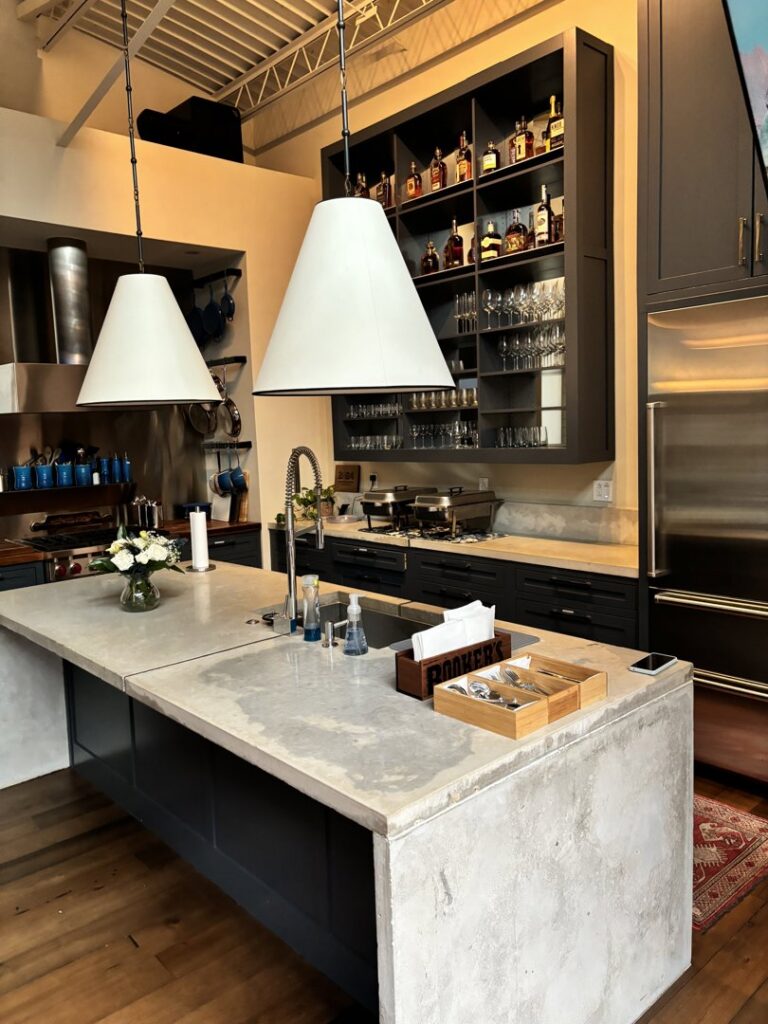 A sparkling clean modern kitchen with a large island and stainless steel appliances, cleaned by Bee Clean Solutions in Lexington, KY.