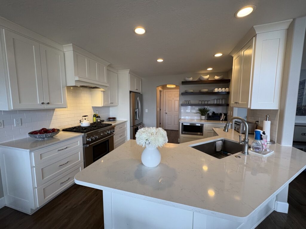 A pristine, modern kitchen with white cabinets and stainless steel appliances, showcasing Kleen Slate's cleaning in Shakopee, MN.