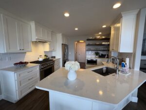 A pristine, modern kitchen with white cabinets and stainless steel appliances, showcasing Kleen Slate's cleaning in Shakopee, MN.
