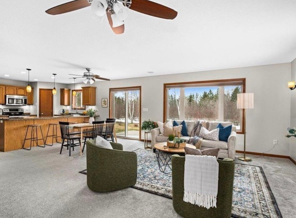 A beautifully clean open-concept kitchen and living room, maintained by Tidy Details house cleaning services in Duluth, MN.
