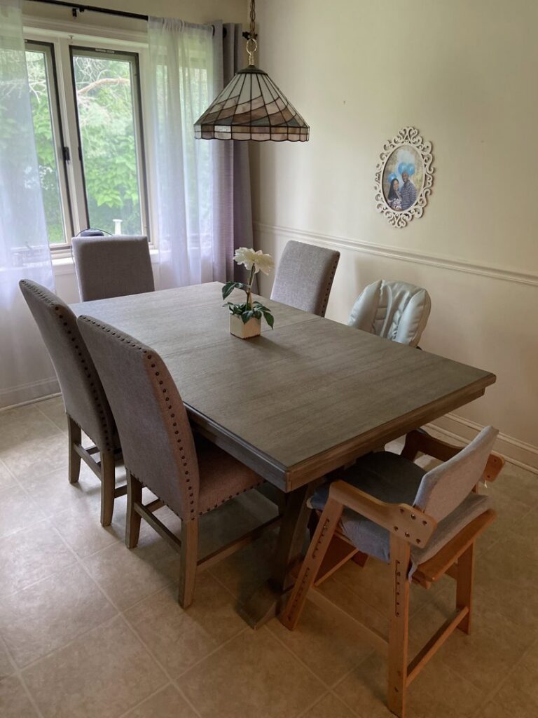 A clean and organized dining room with a modern table and chairs by Consciously Cleared & Contained LLC in Elsmere, DE.