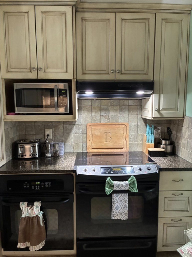 A sparkling clean and organized kitchen counter with appliances and cabinets, showcasing the results of Royalty Cleaning LLC in Fresno, CA.