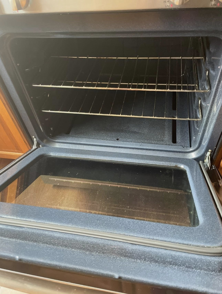A sparkling clean oven interior with racks, showcasing the results of professional cleaning by Crystal Clear Cleaning Services in New Haven, CT